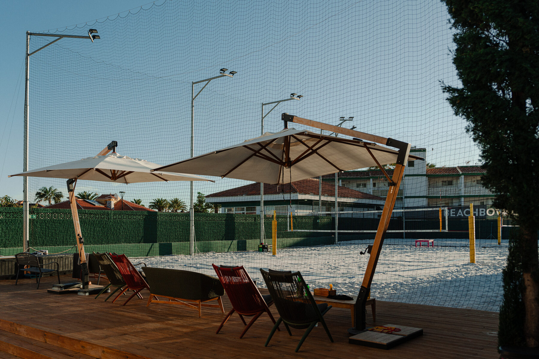 Lounge deck overlooking the courts at golden hour