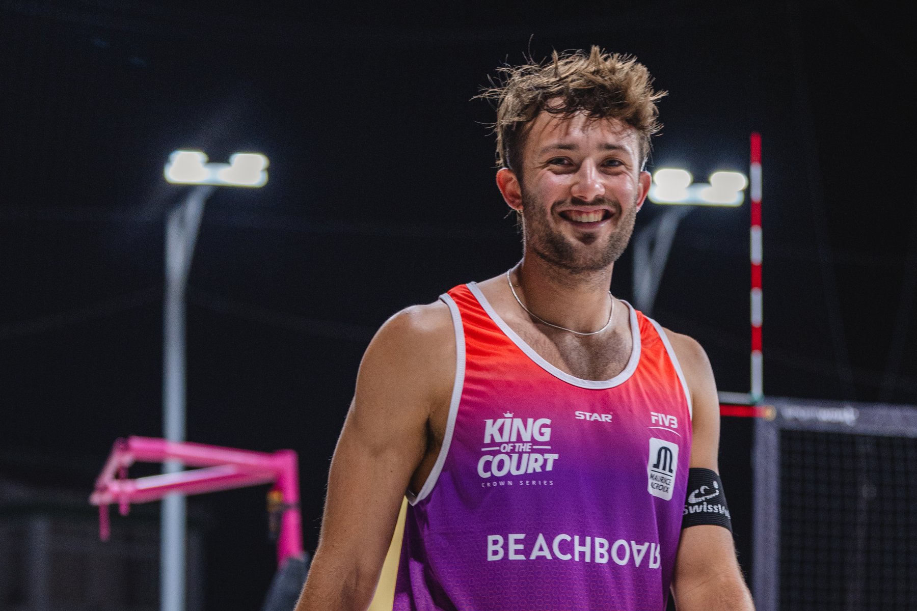 Smiling player in a King of the Court Beachboard jersey