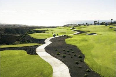 A fairway with volcanic black terrain at Golf del Sur